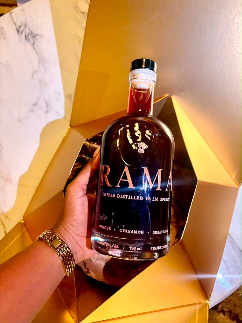 The Rama bottle with copper lettering, held in its golden presentation box